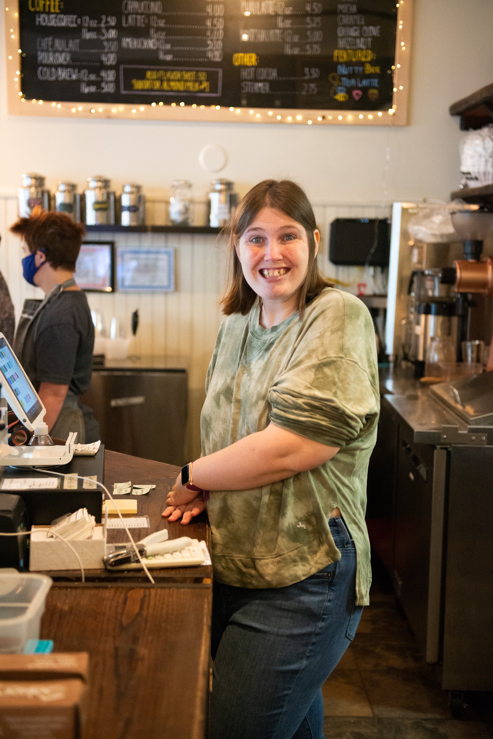 Helen K-R working as a cashier at Soltane Café.