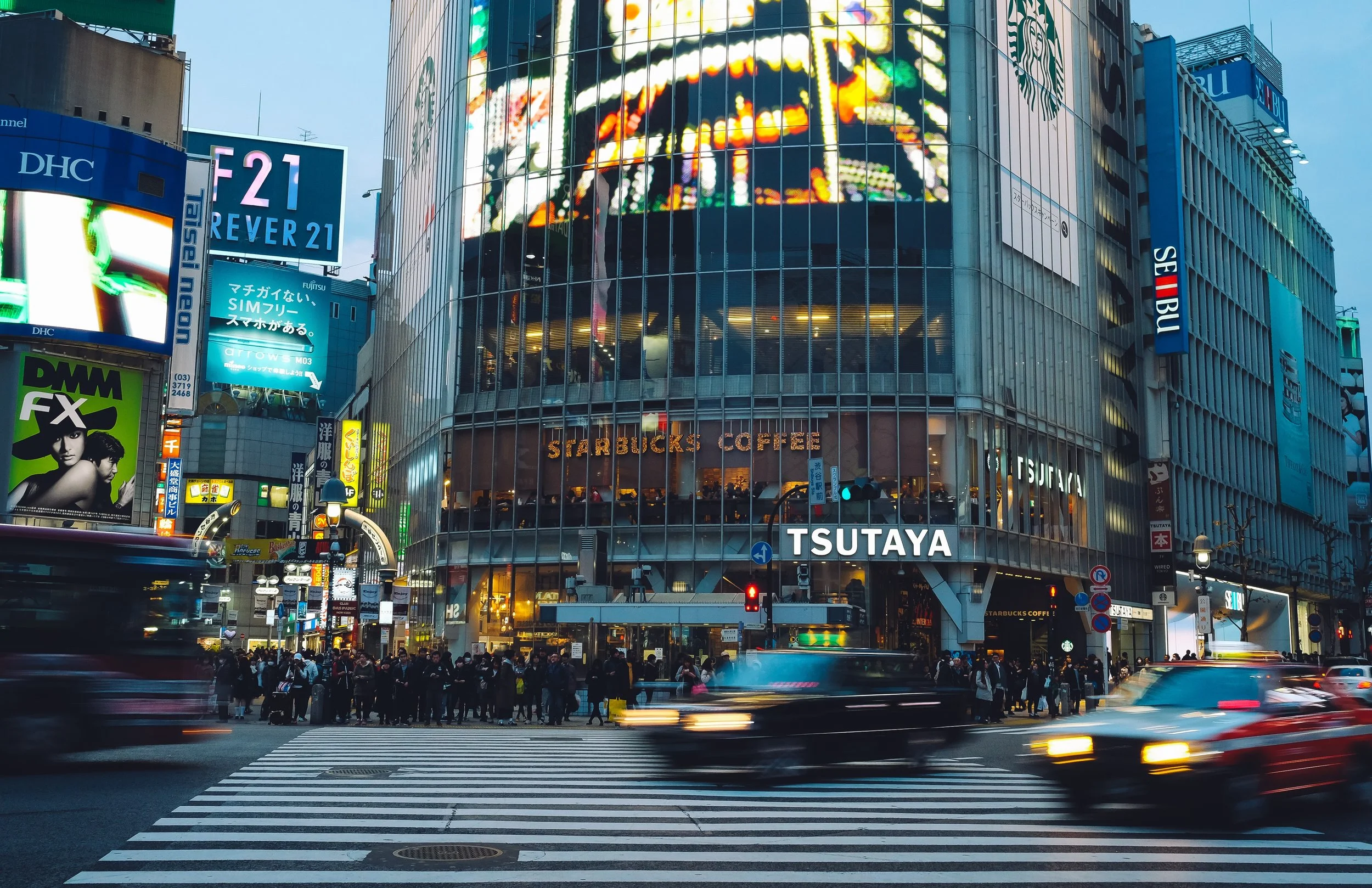 cars passing by on street in japan.jpg