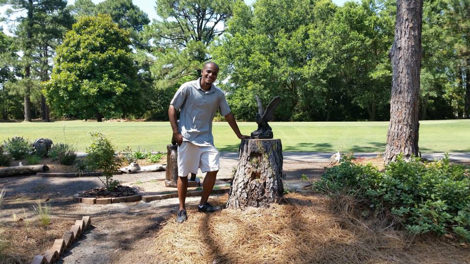 3 in 1! Posing next to a Bald Eagle in Myrtle Beach, while golfing