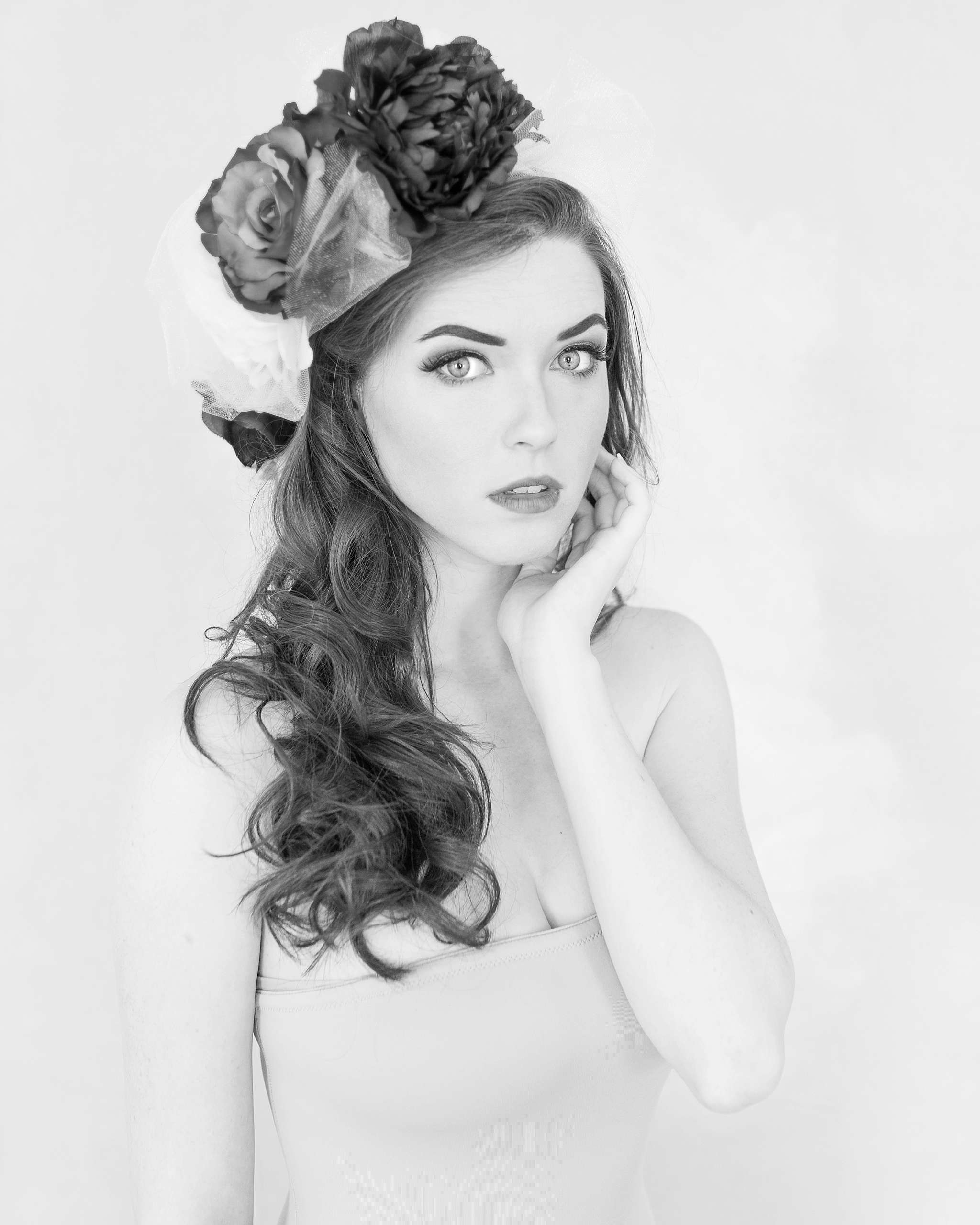 Contemporary boudoir, glamour, head shot photo shoot with an aspiring actress. Ashley looked stunning in a DIY Frida Kahlo inspired head piece, tulle skirt, gold sequin dress and white sheet.