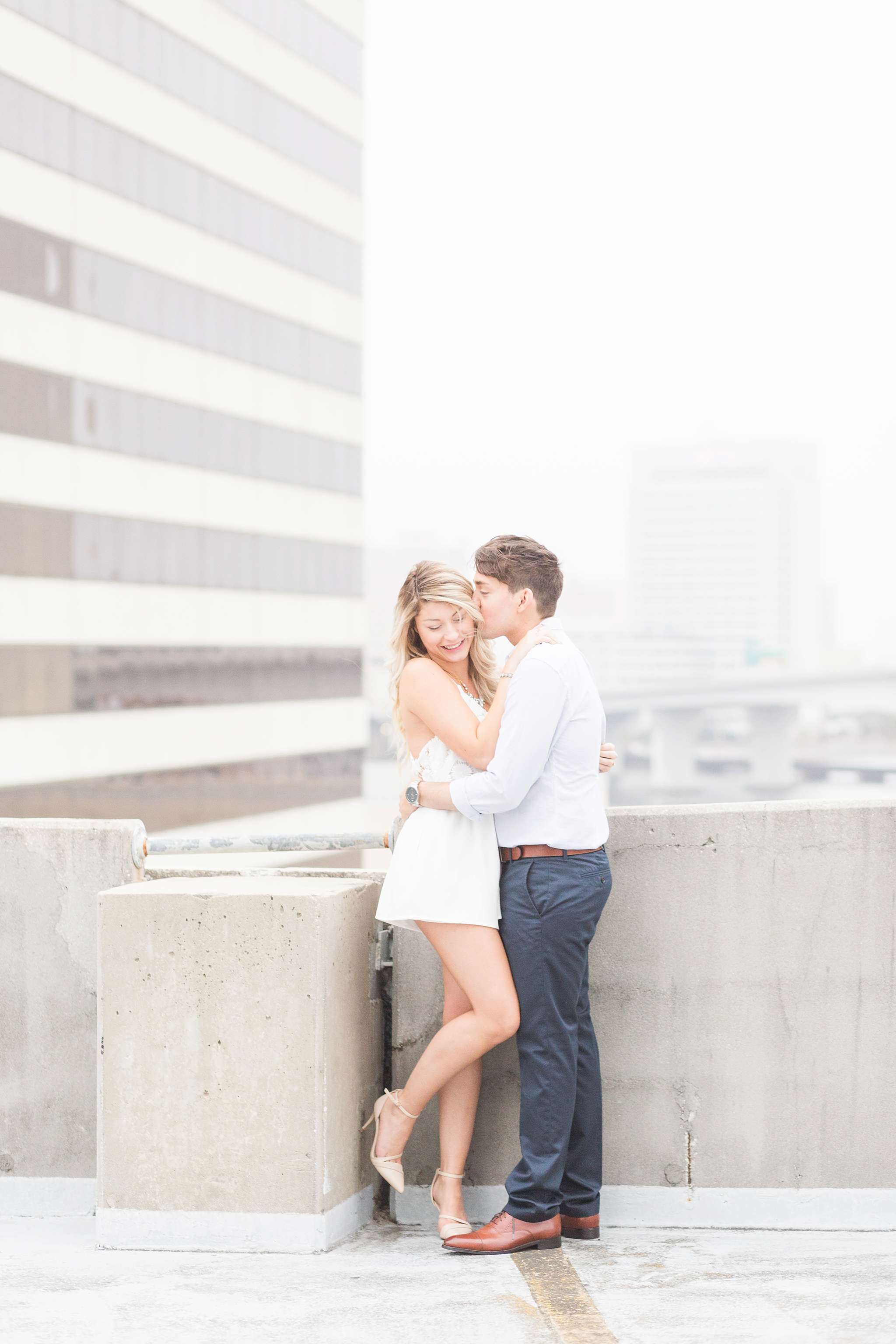 Surprise engagement session in downtown Jacksonville, FL. A surprise proposal taken place on top of buildings, and skyscrapers in Florida urban area.