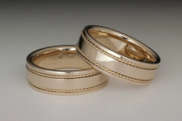 Matching yellow gold mens' bands with inlaid twisted wire.  
