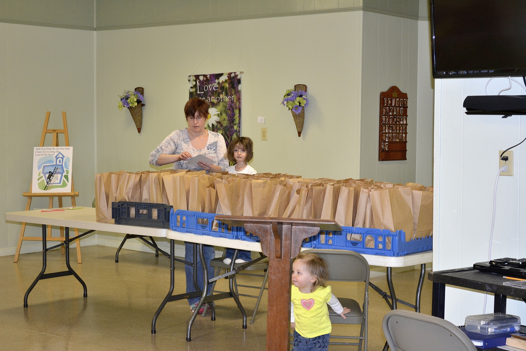 Missy making bag lunches with assistance from some little helpers