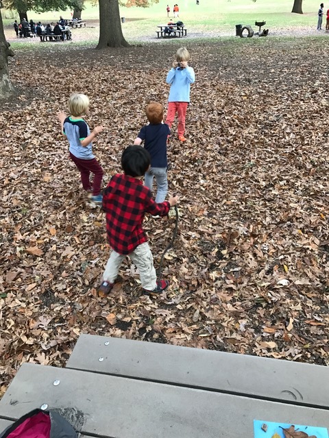 A pretend photo shoot in the park.