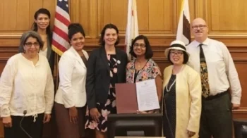 HAMO staff members Nora Nicholson (fourth from right) and Anu Menon (third from left) with the San Francisco Commission on the Status of Women.