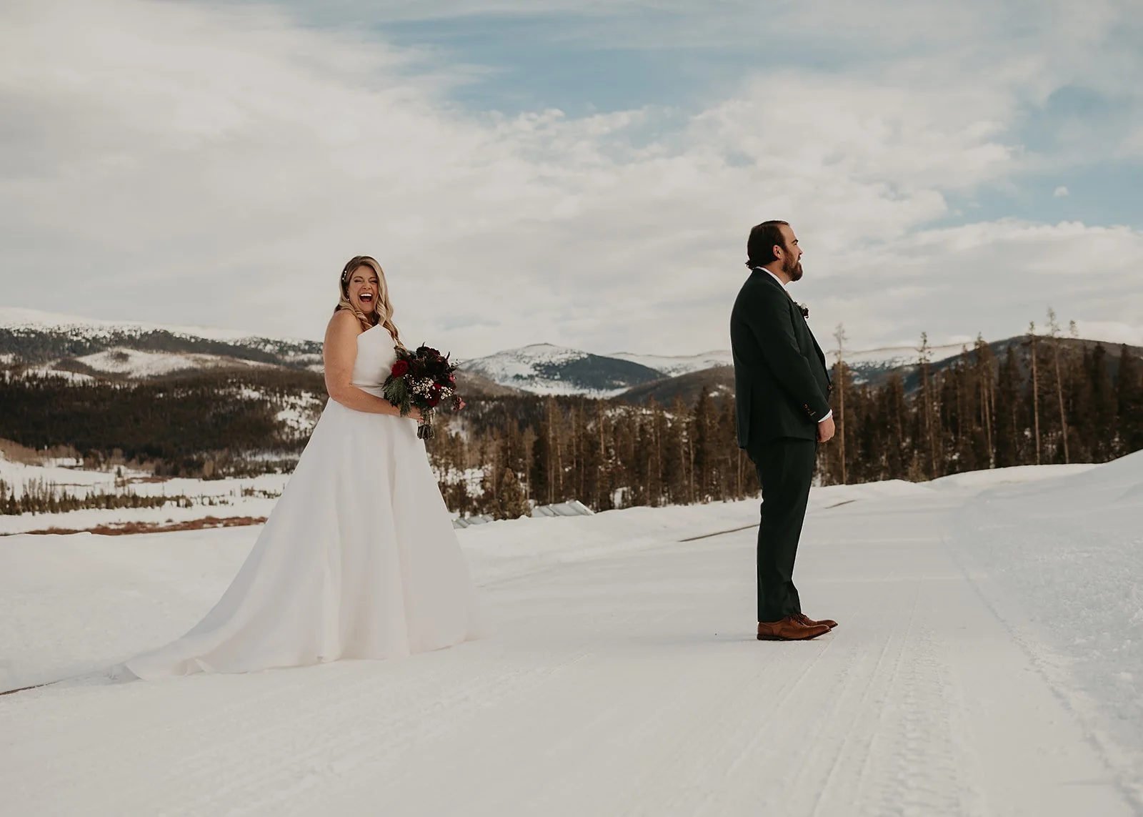 First look in snow at Devil's Thumb Ranch wedding