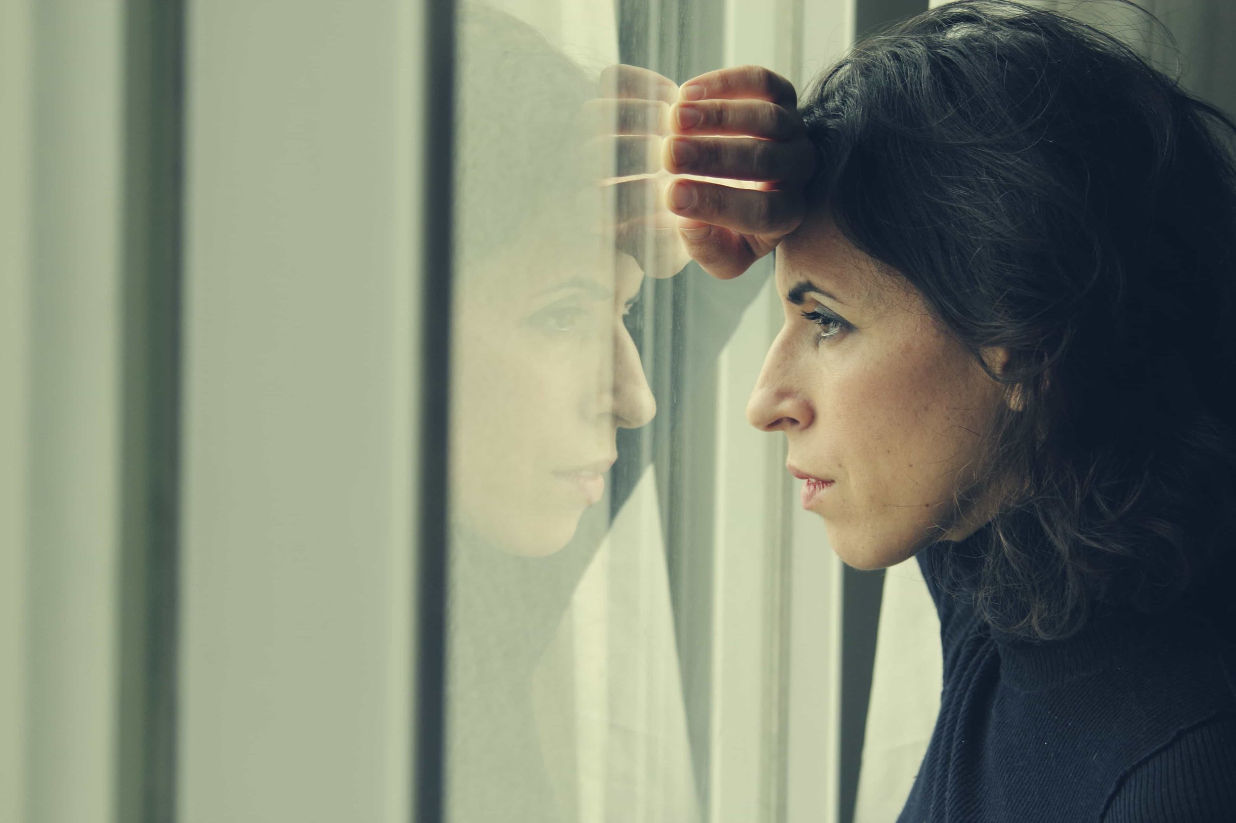  woman thinking about her alcohol addiction  