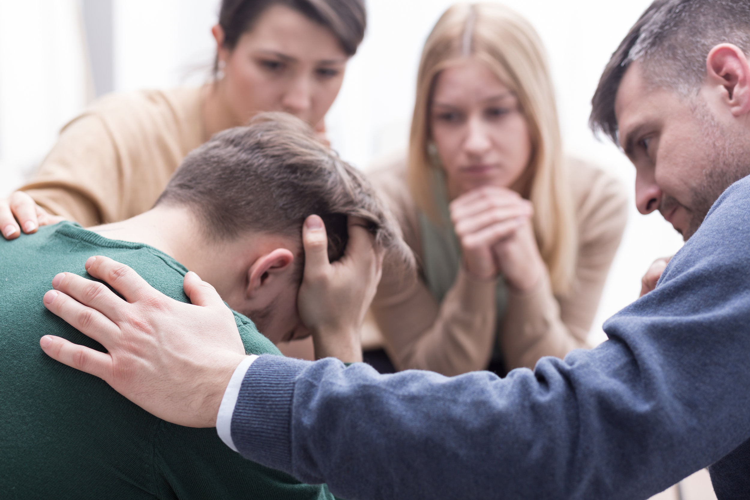  man depressed at a mental health group 