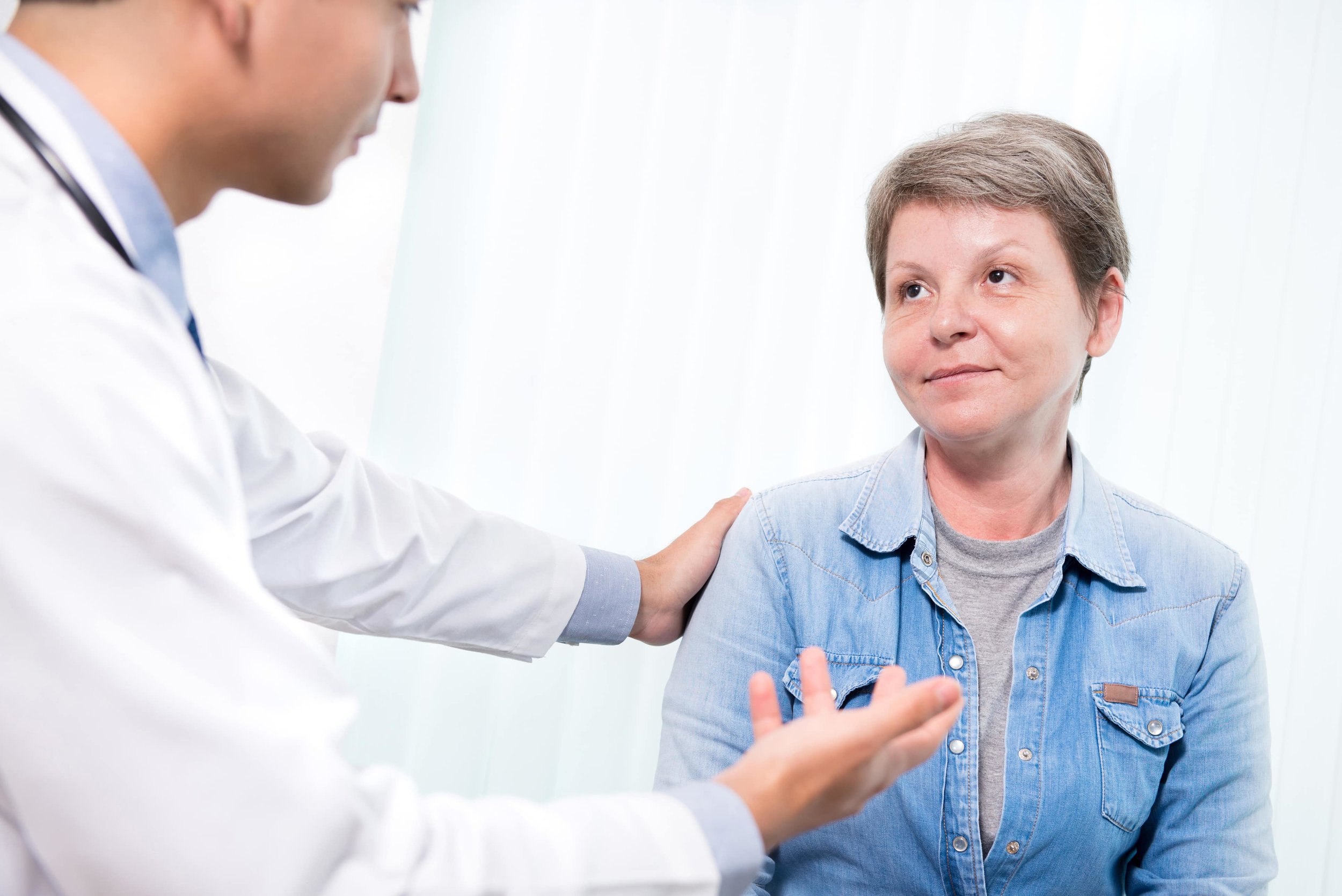  woman visiting doctor for treatment 
