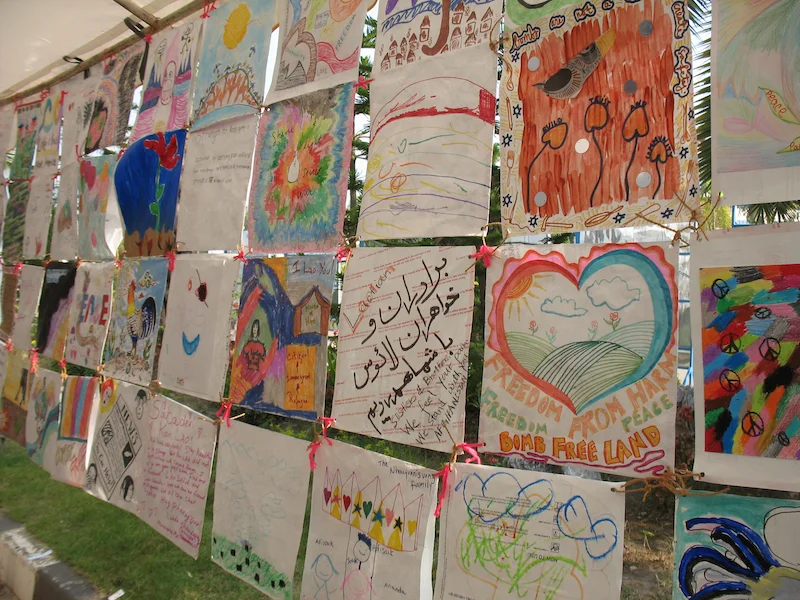 I worked with Legacies of War to develop the Tapestry of Hope: Weaving Together a Bomb-Free Future , a collection of art pieces from organizations, individuals, and collectives from across the nation to install in Vientiane, Laos during the Convention on Cluster Munitions First Meeting of State Parties . 2010