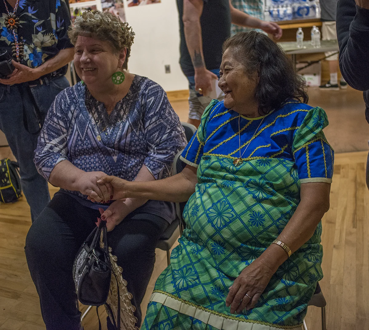 Kianna's great aunt or "Mama" embraces Kianna's adopted mother. This was the first time Kianna's Marshallese family met her adoptive parents. @Savannah Blake