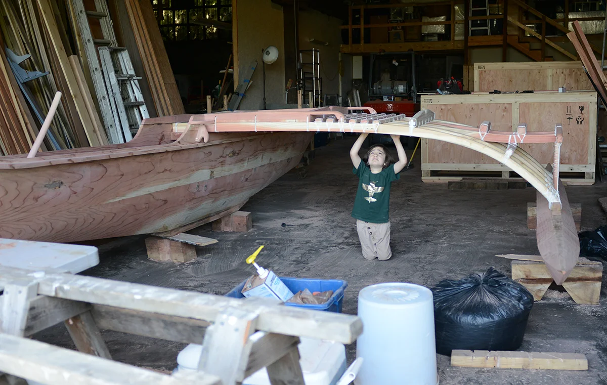 Tin Tin plays around the outrigger at the building site in Portland. @Savannah Blake