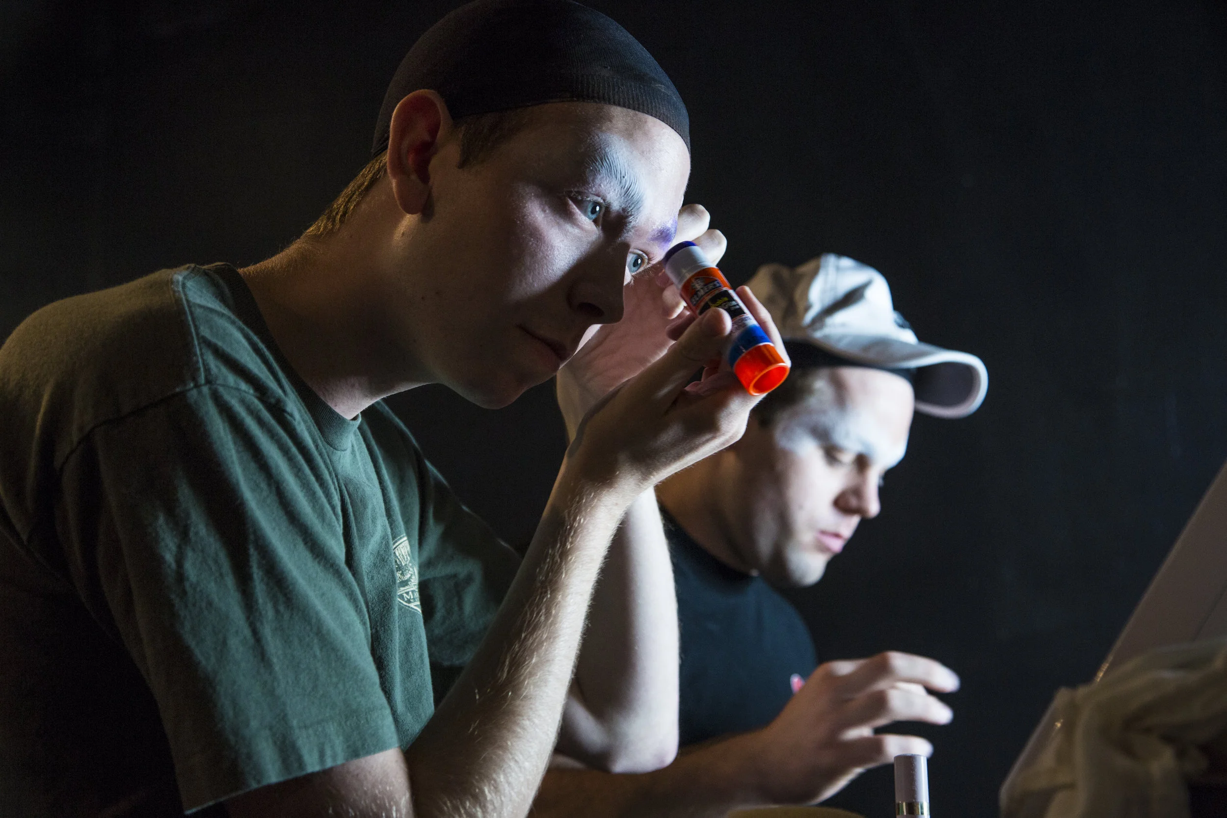 Austin Drew (right) and his boyfriend start putting on their makeup in preparation for the Burnin’ Up Drag show. This is the first time the couple has ever dressed in drag on been onstage.
