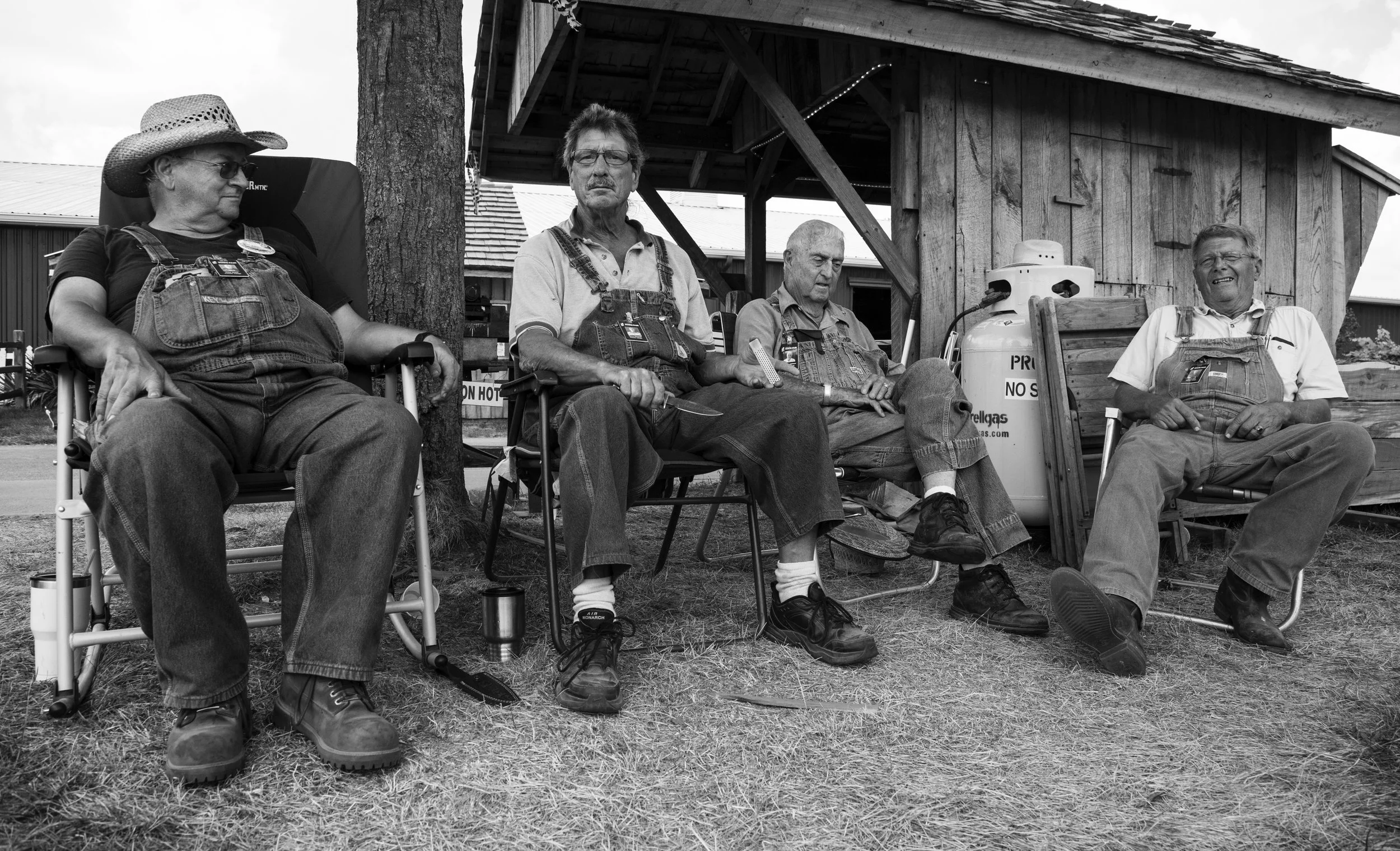 A group of farmers take a break from working during the Indiana State Fair.