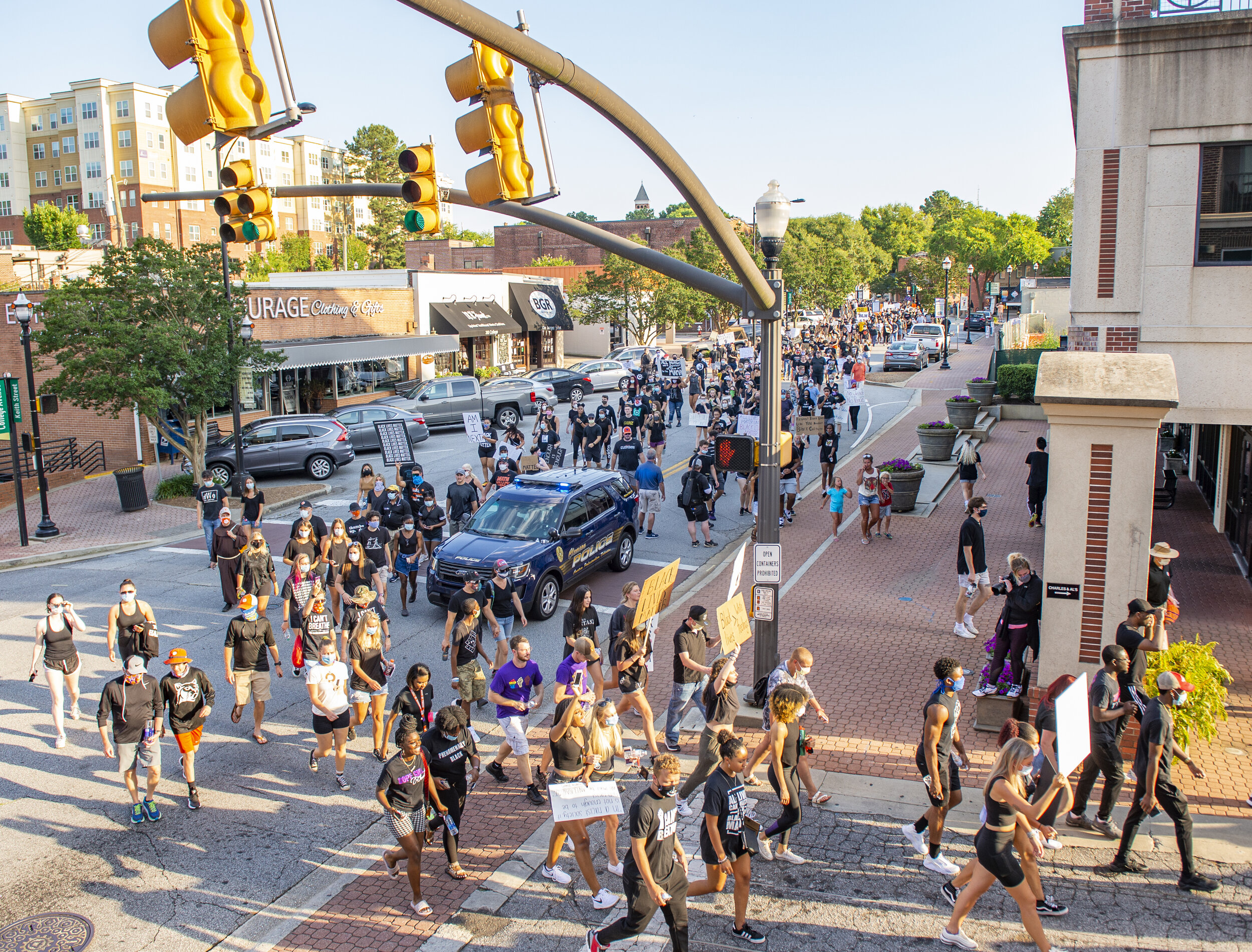 Thousands of protesters march along the streets of downtown Clemson.