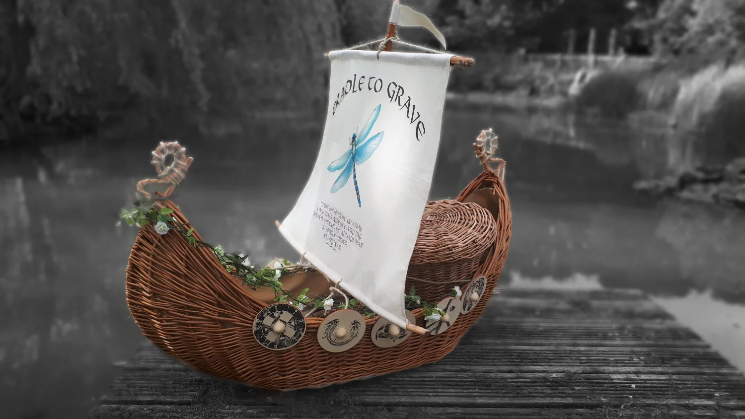 cradle to grave viking ship casket with dragonfly logo.jpg