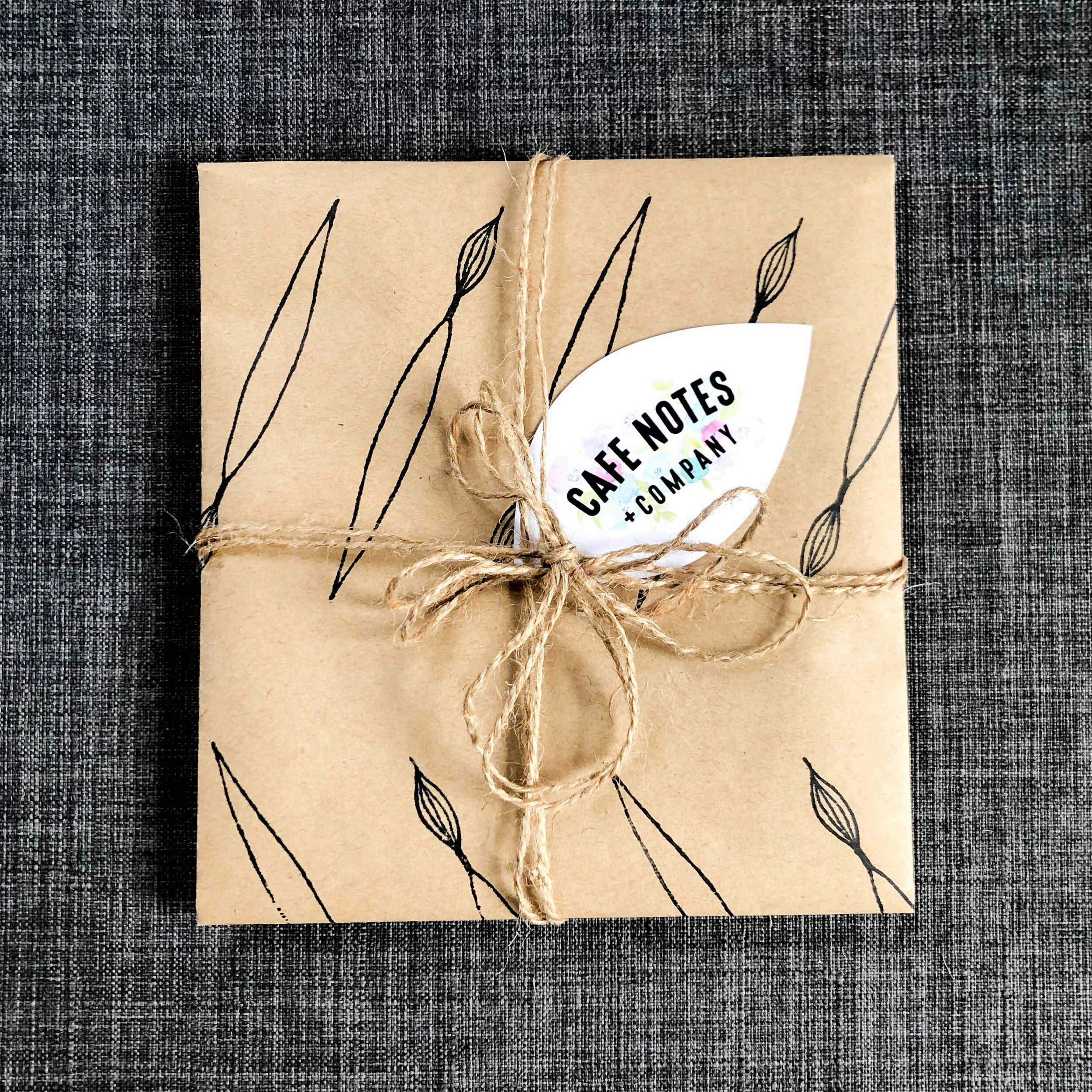 Hand stamped kraft paper gift wrap featuring hand drawn leaf