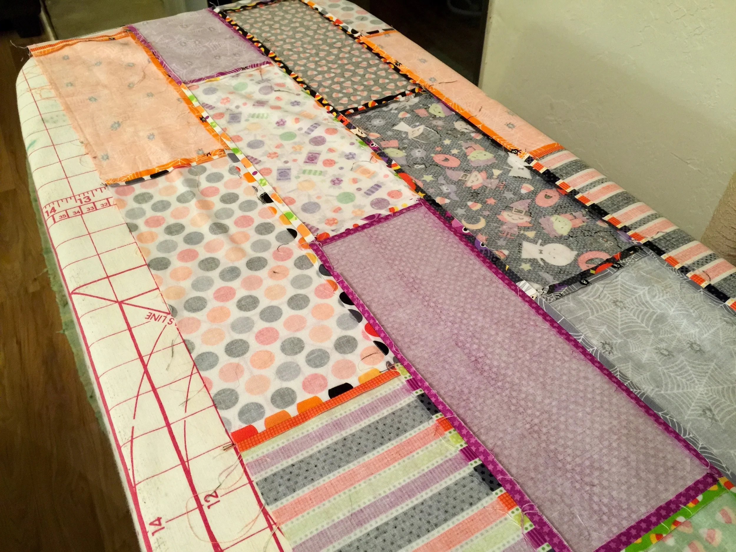 Halloween Brick Quilt | I designed this quilt to use an entire fat quarter bundle with minimal waste, the brick shaped rectangles are arranged so that I didn't have to match up any seams when piecing this patchwork quilt.
