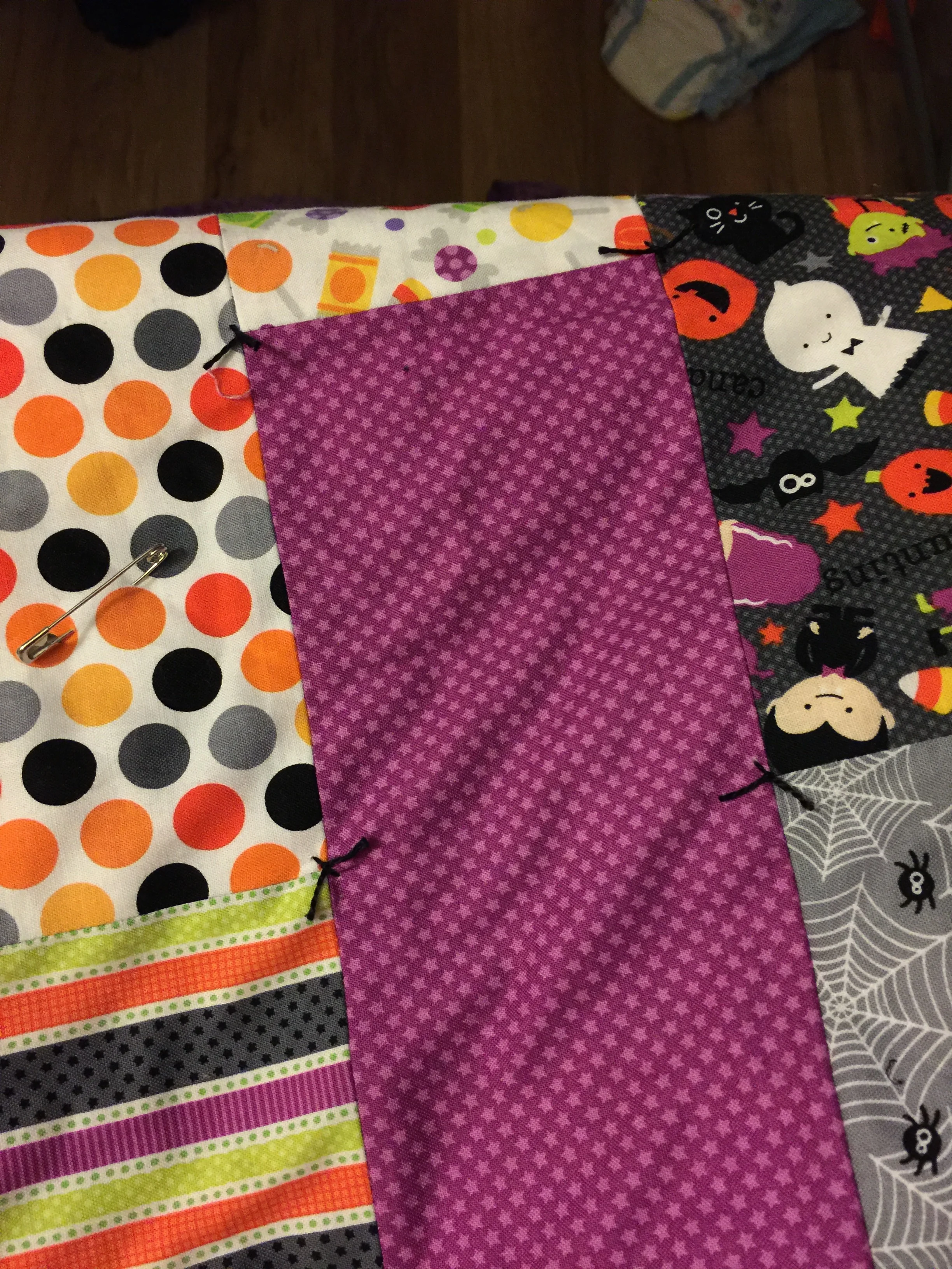Halloween Brick Quilt | I designed this quilt to use an entire fat quarter bundle with minimal waste, the brick shaped rectangles are arranged so that I didn't have to match up any seams when piecing this patchwork quilt.