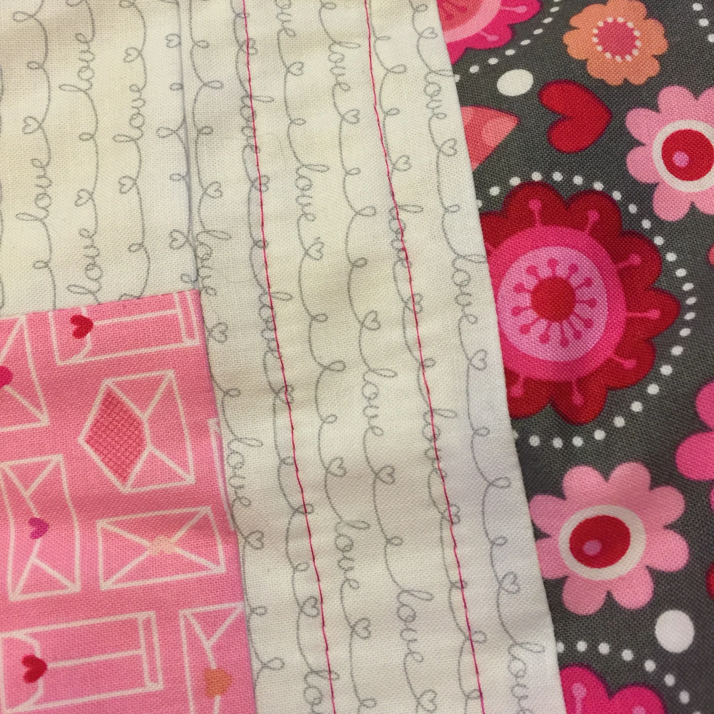 Jelly Roll Baby Quilt Tutorial: First rows of straight line quilting on Jelly Roll quilt complete