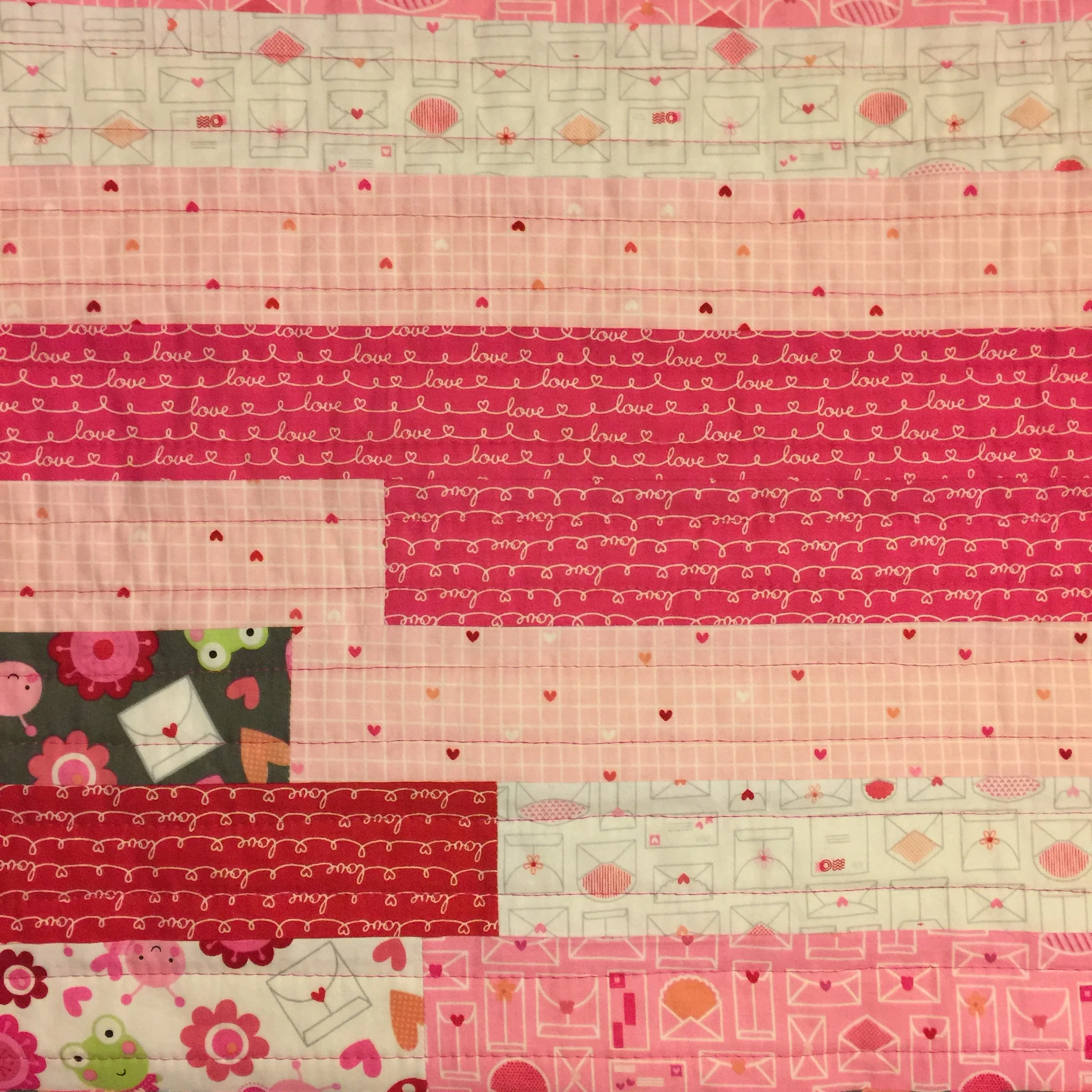 Jelly Roll Baby Quilt Tutorial: Straight line quilting on Jelly Roll quilt top complete