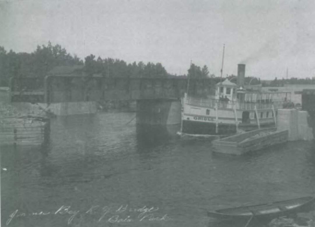   Historical photograph of the Oriole steamship arriving in Bala through the swing bridge 