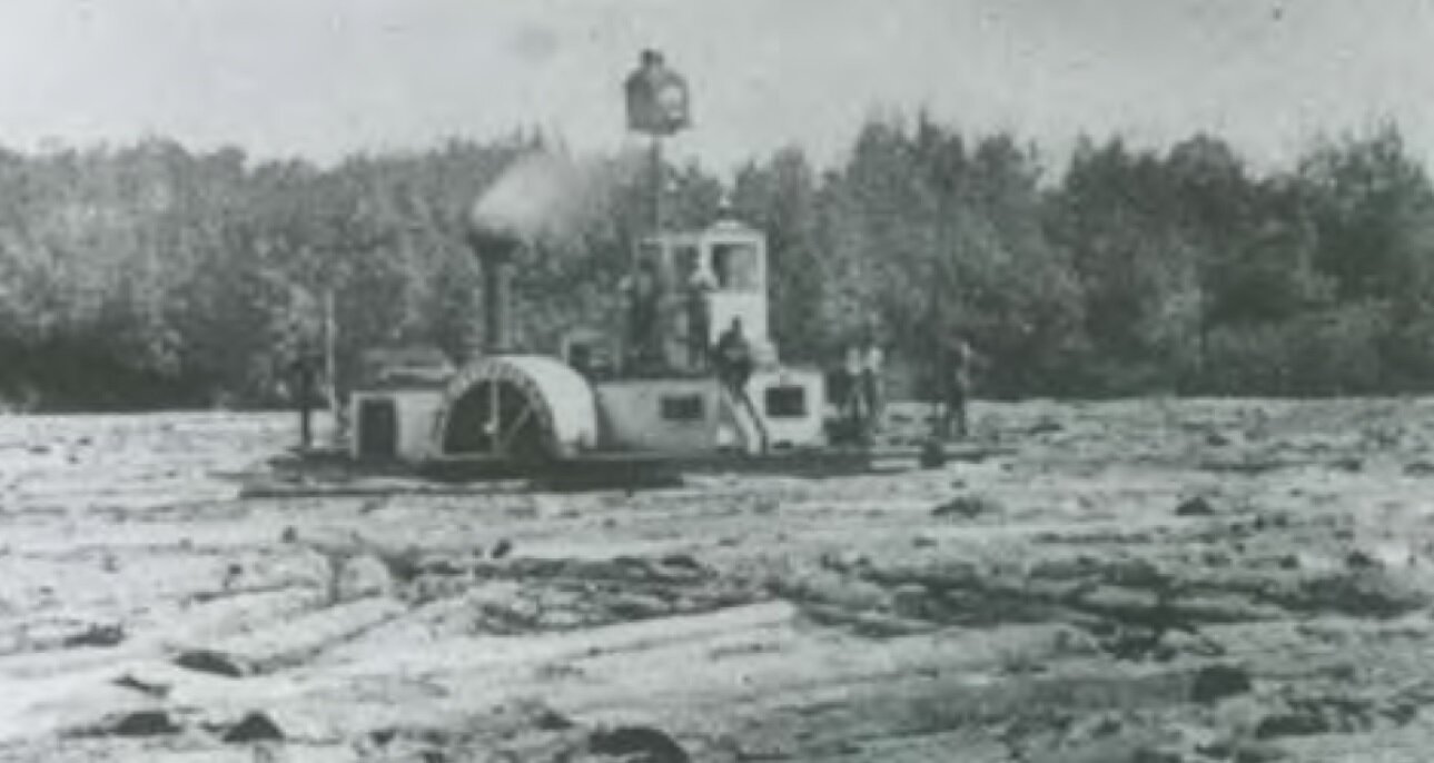   A steamship driving logs on Lake Muskoka 