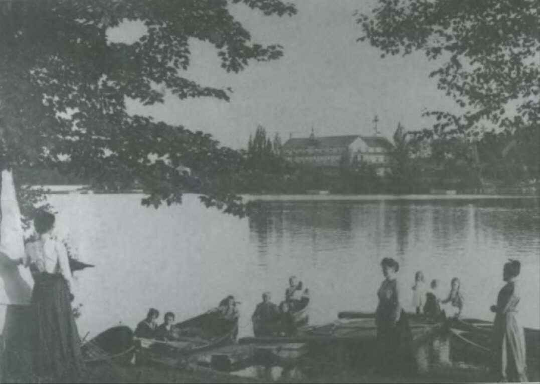   Boating on Lake Muskoka, with a tourist hotel across the lake 