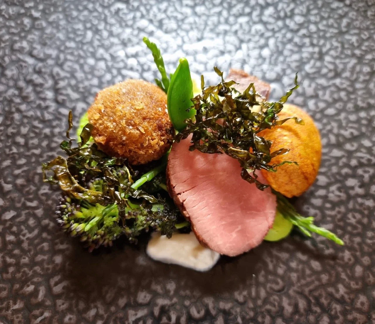 Win a 5 course tasting meal and a glass of fizz for 2 at Purslane (worth £200)