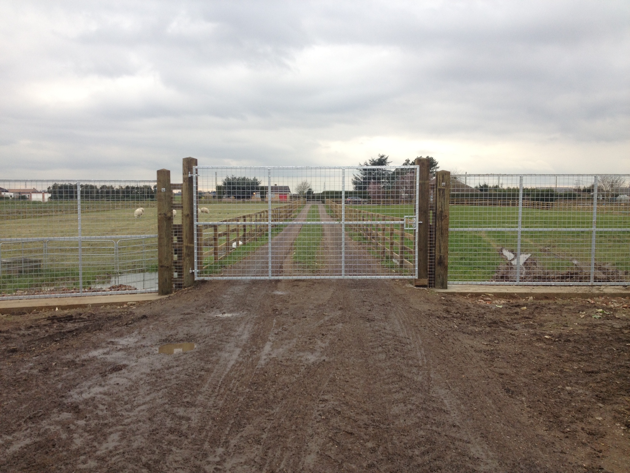 Front gate with concrete footings