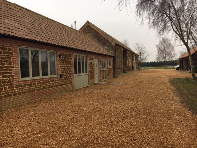 The finished job - weeds gone, pot-holes filled and the barns looking as good as new