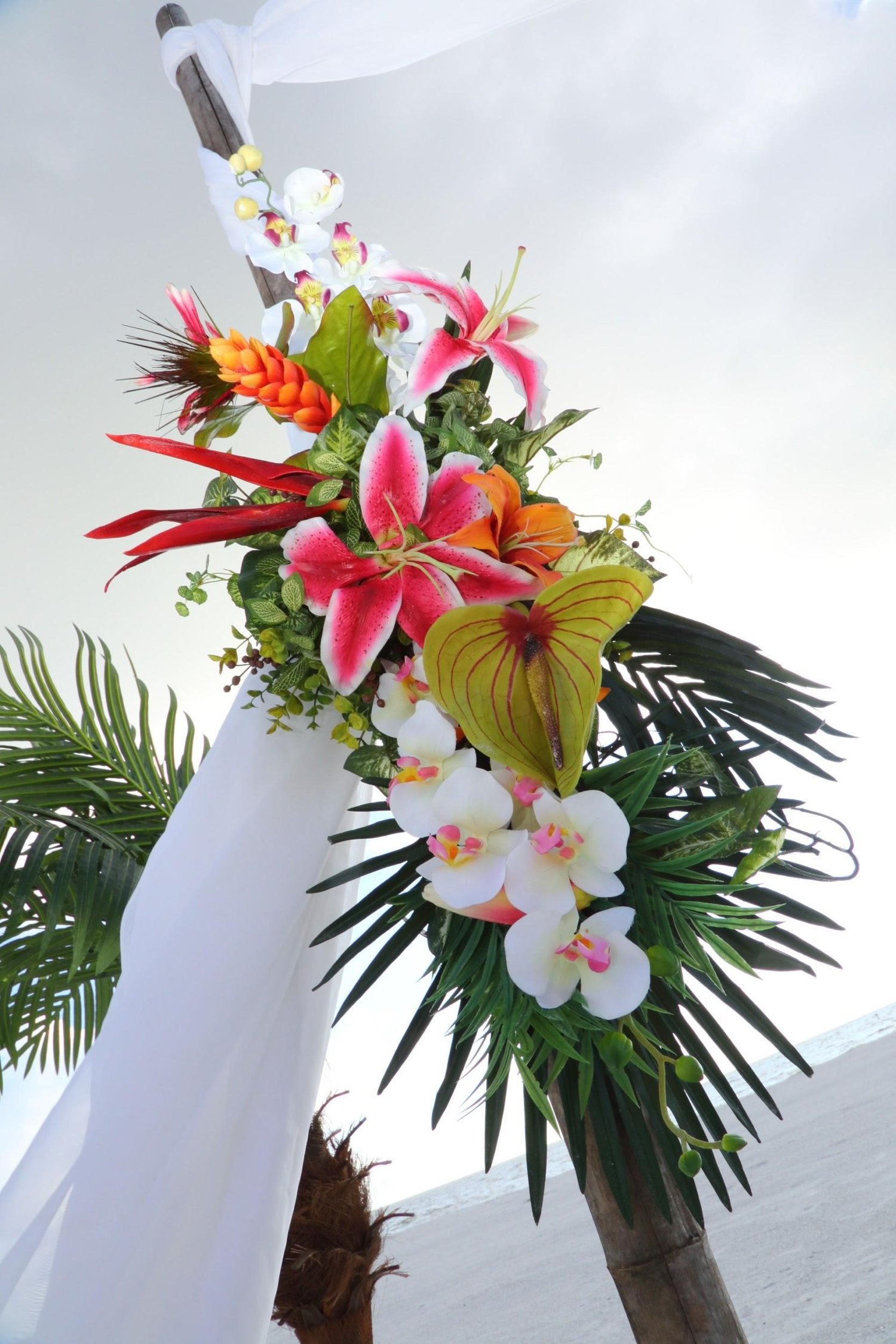 We just love these stunning tropical flowers for the ceremony arch!