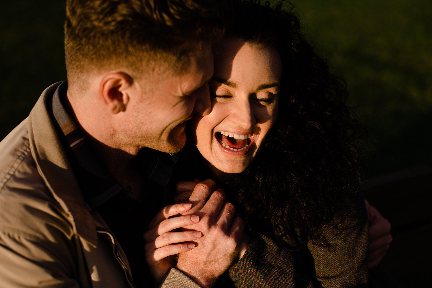 Close shot of a couple holding hands and laughing - Relaxed and fun pre wedding shoot