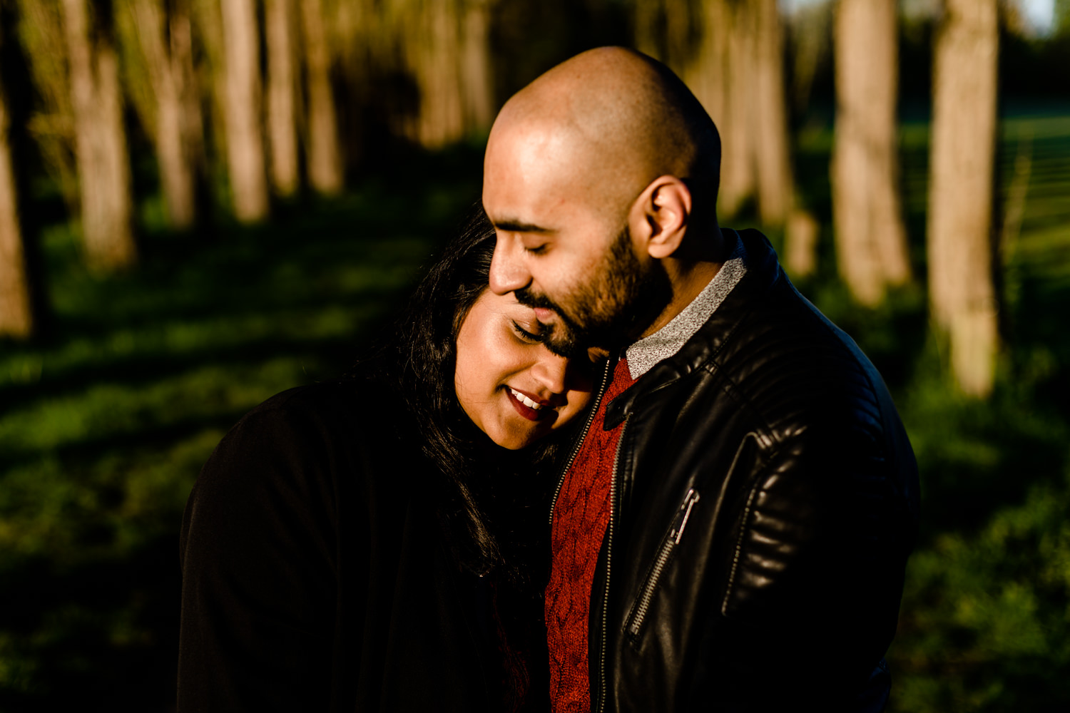 Couple cuddling on their pre wedding shoot at sunrise in Manchester