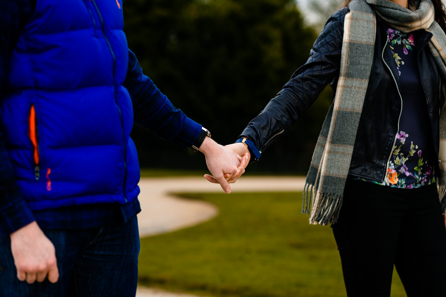 Close up of an engaged couples hands.