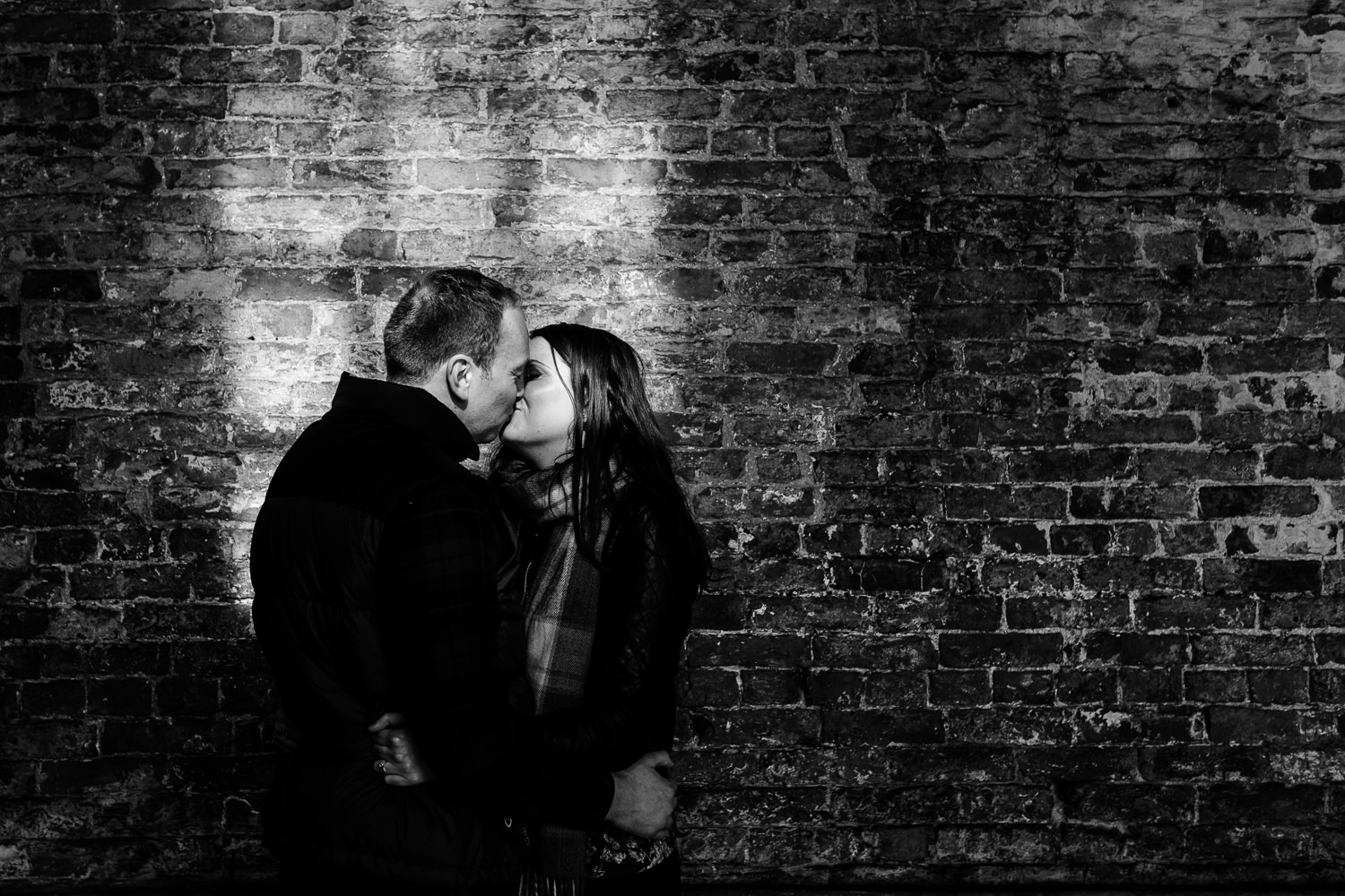 Kissing couple in window light at Dunham Massey.
