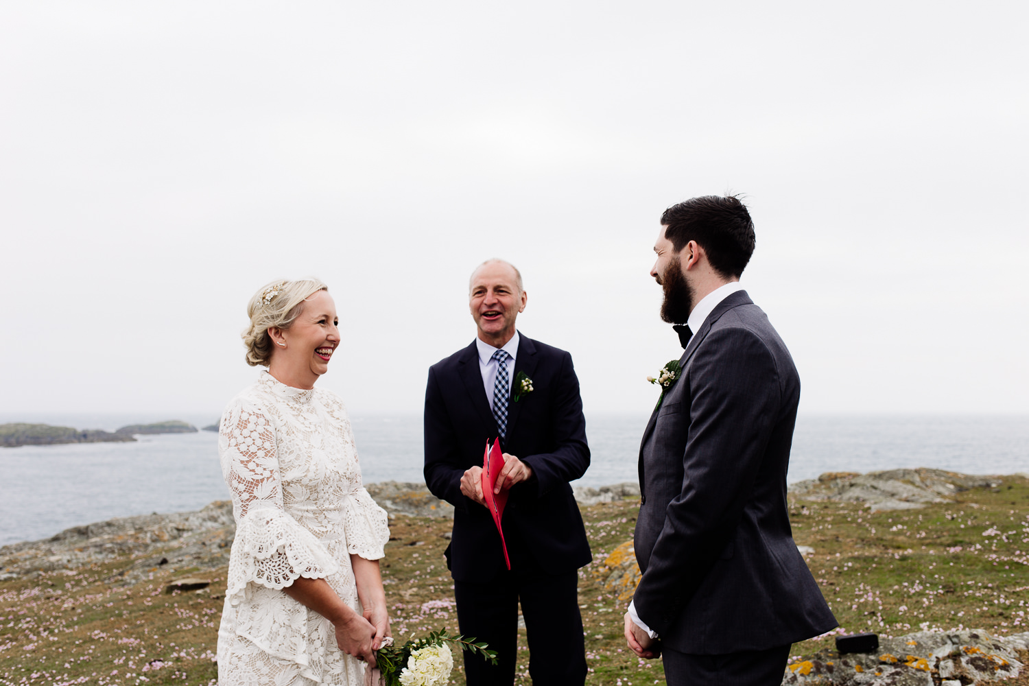 Outdoor ceremony on the Anglesey headland by Wales wedding photographers, About Today Photography.