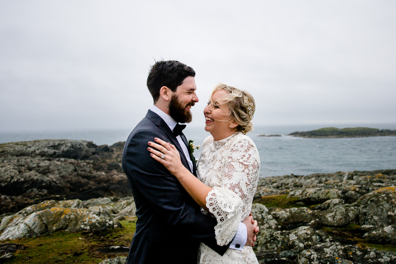 Wales Wedding Photographer, a bride and groom on the cliffs of the headland in Anglesey.