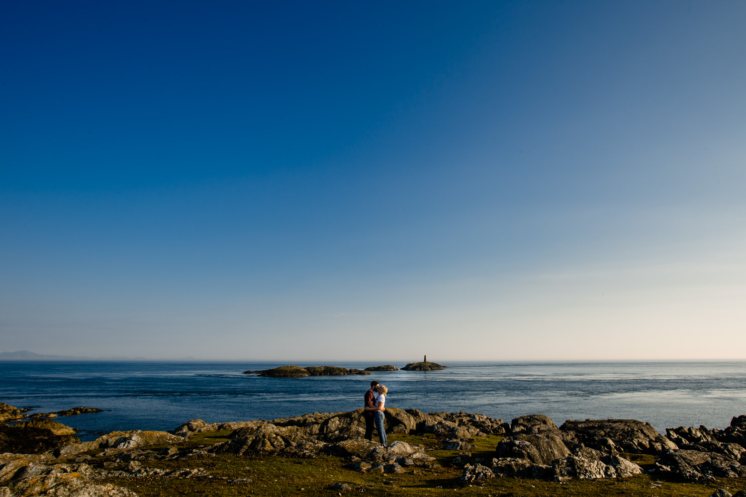A view from the headland looking out to sea, from Kate & Sean's sunny pre wedding shoot on Holy Island, by Anglesey wedding photographers Zoe & Tom