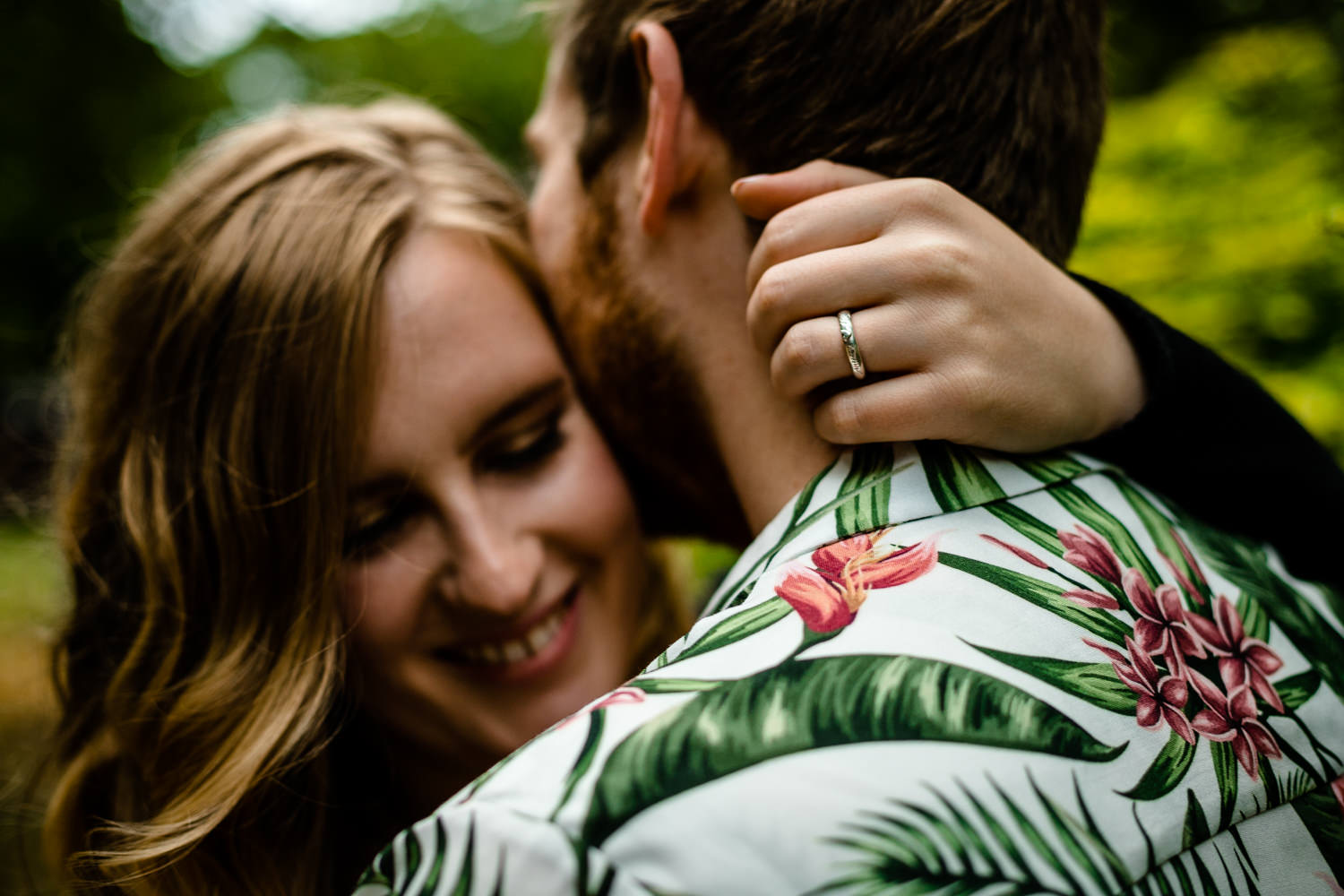 Close up cuddle on a pre wedding shoot in Manchester, by colourful wedding photographers. 