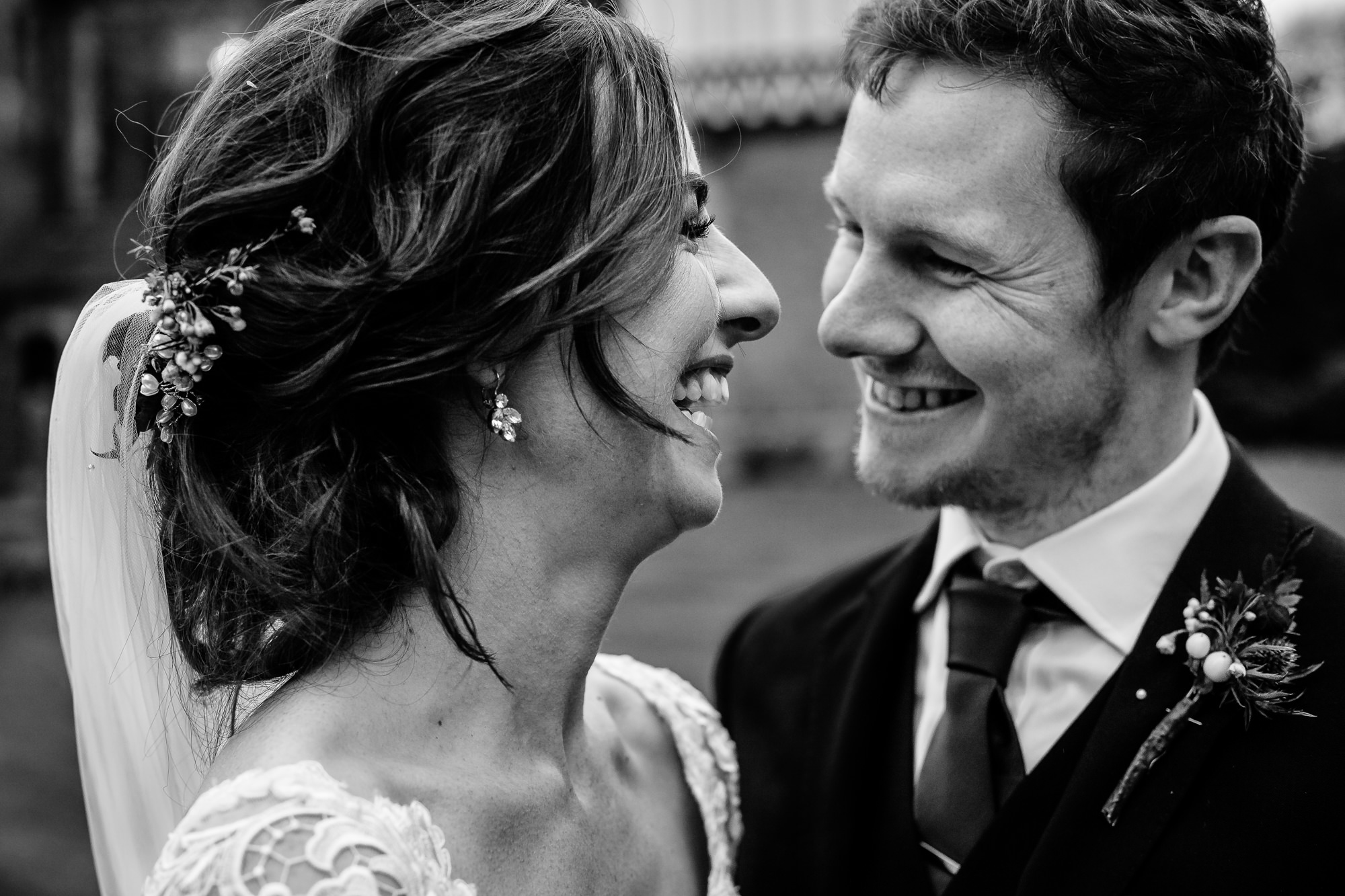 Close up of a bride and groom laughing on their wedding day at Tyn Dwr Hall
