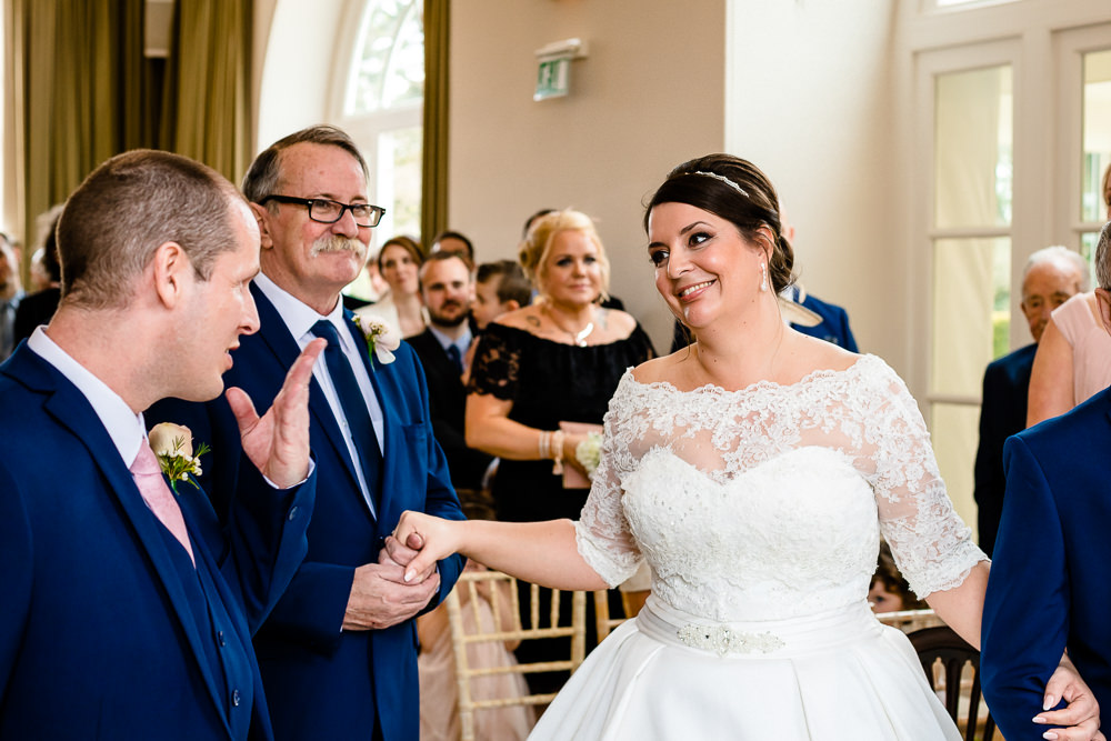 A bride sees her groom for the first time at a Iscoyd Park Wedding