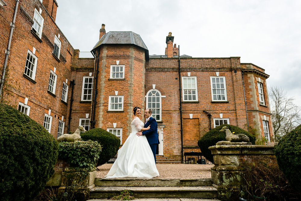 A newly married couple stood in the grounds of Iscoyd Park house