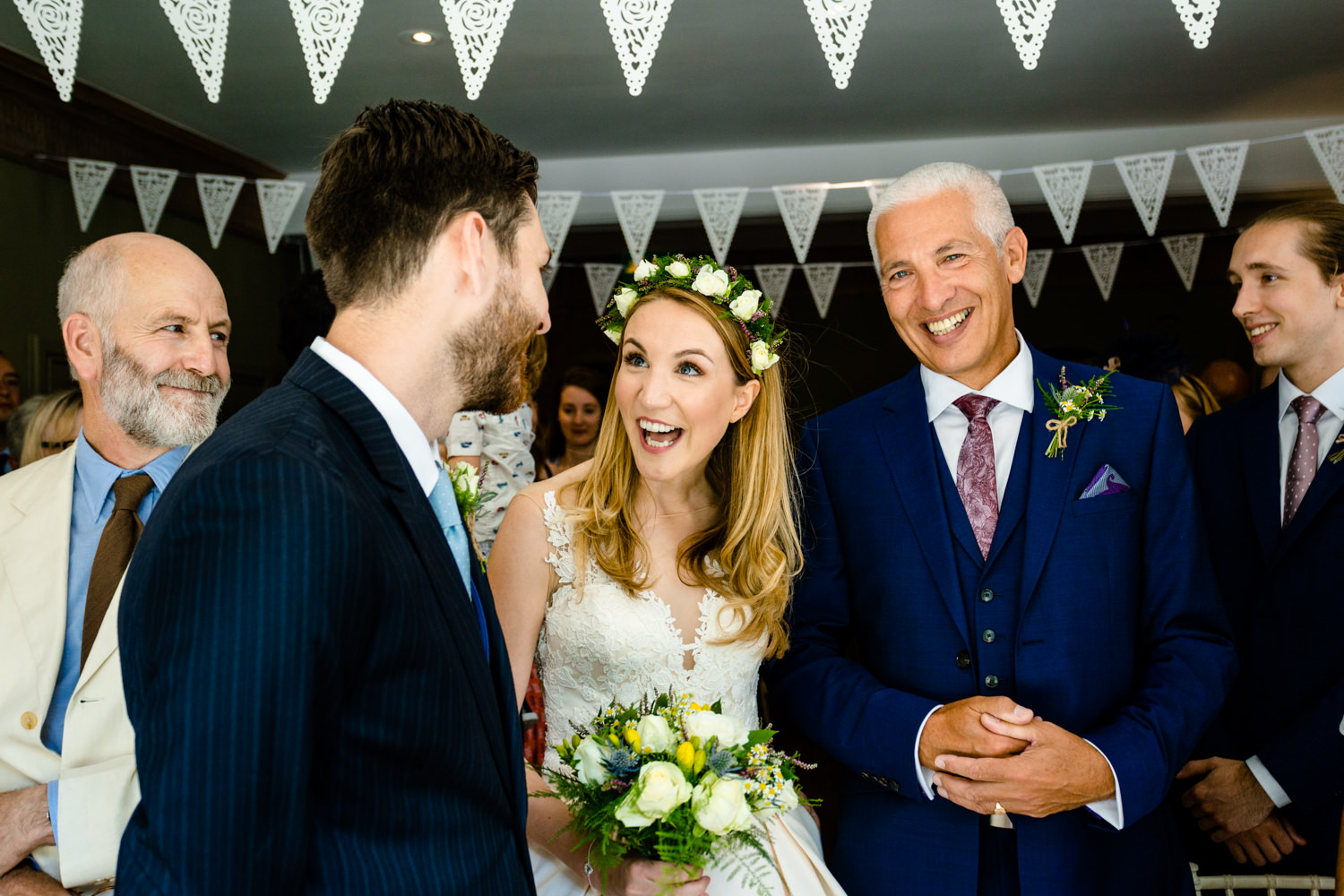 A bride excited to see her groom, wedding photography Whirlowbrook Hall