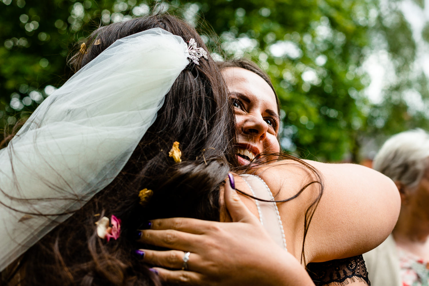 Hugging the bride at a relaxed wedding