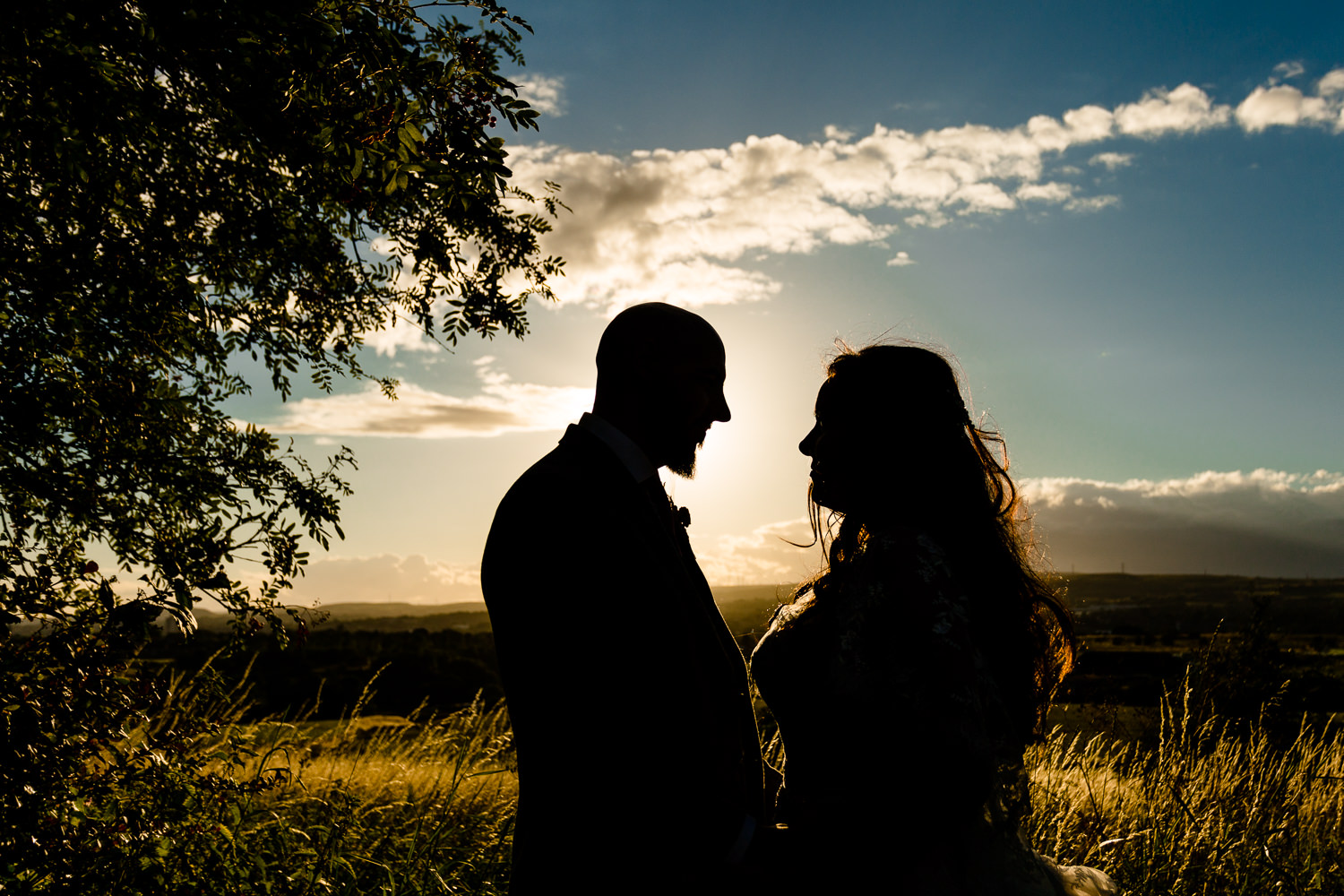 Colourful Rochdale wedding photographer, a bride and groom silhouette at sunset