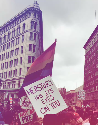 Sign: "Herstory has its eyes on you" - a feminist twist on a popular line in the Broadway musical, Hamilton . Women's March Bay Area - Oakland, CA.