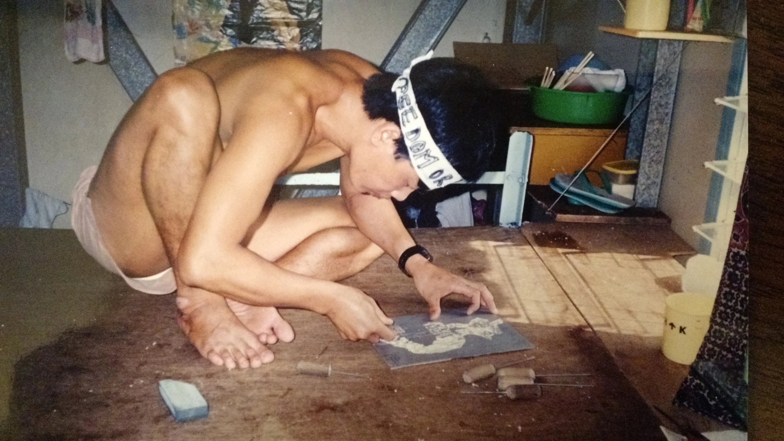 Credit: BPSOS Archives . The man in the photo, possibly Vu Manh Tuan, etching the shape of Vietnam onto a metal plate.