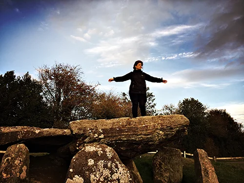 Paula, rocking a "You Shall Not Pass" groove on Arthur's Stone, a Neolithic chambered tomb, 3,700 BC