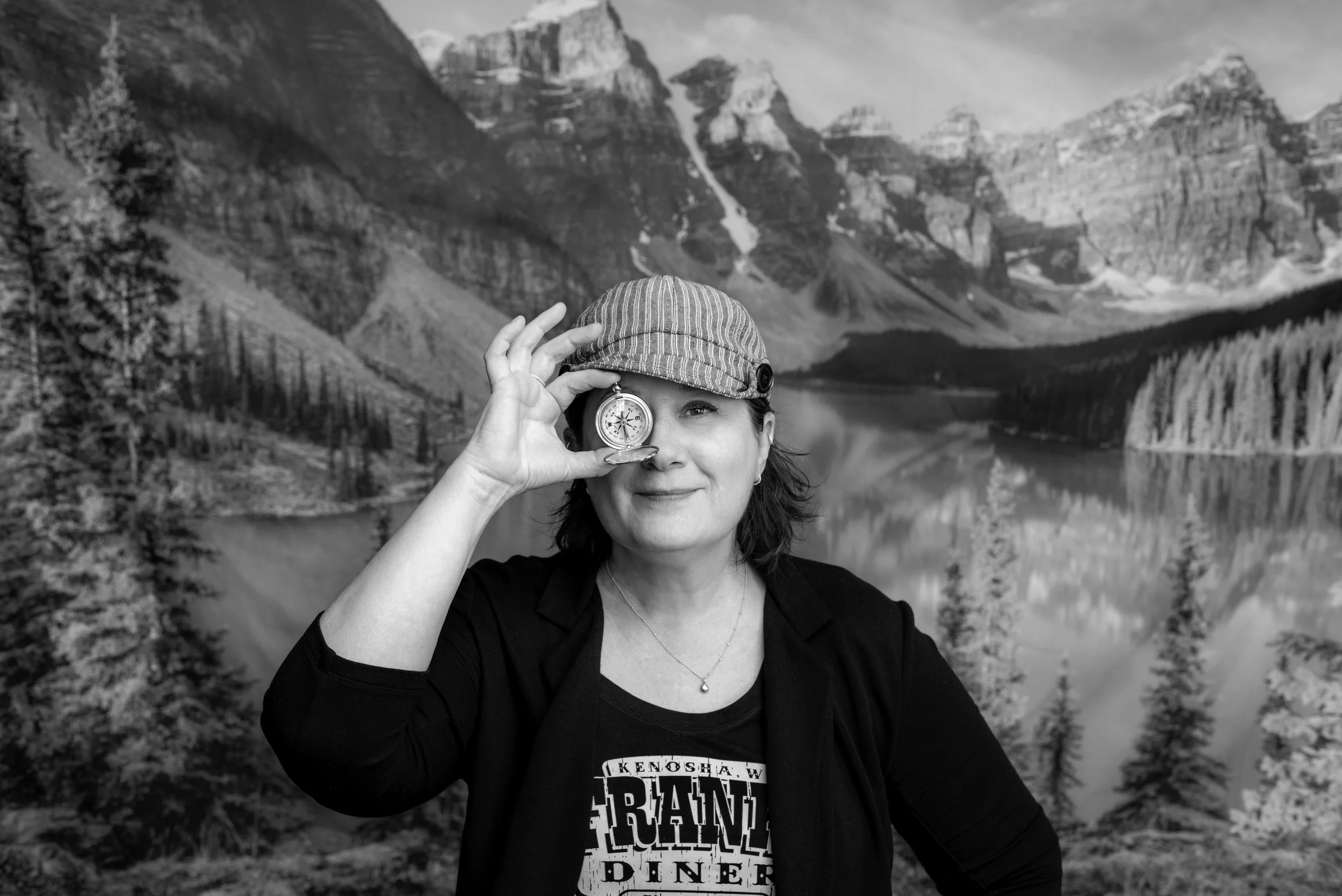 Portrait of Wisconsin location scout and manager Stephanie Bartz holding up a compass to signify her role as a Wisconsin location scouter
